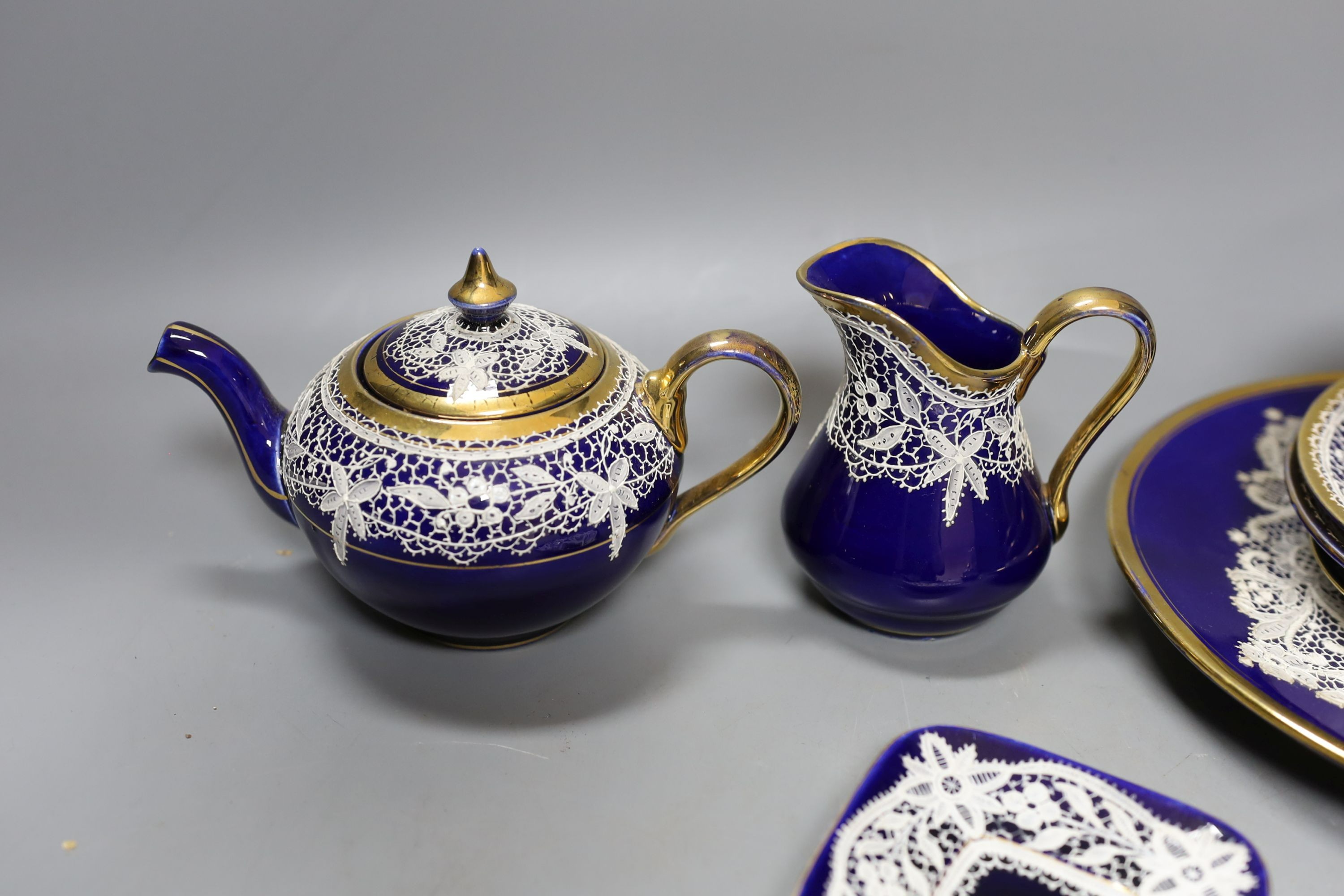A group of Venetian Lace pattern enamelled blue glazed porcelain teaware (13)